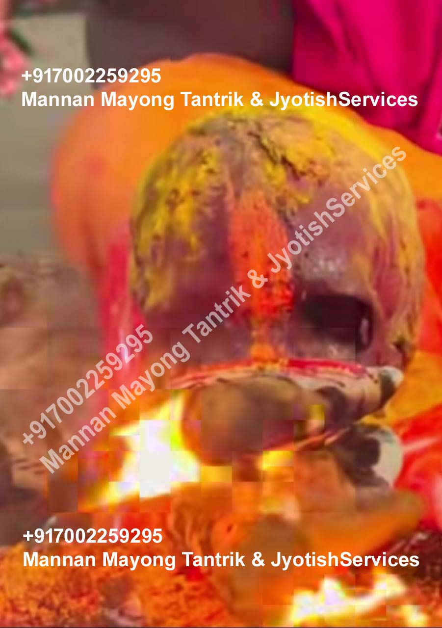 Turmeric and vermilion offerings during a traditional Jyotish rite in Mayong